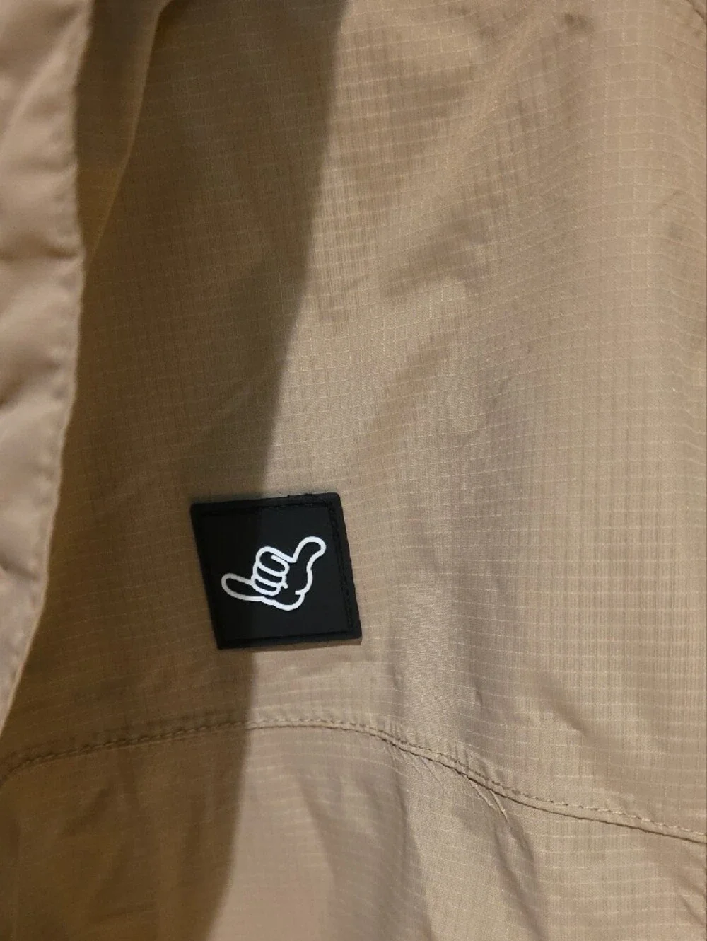 Dutch Bros Beige Windbreaker with Orange Trim